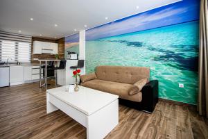 a living room with a couch and a kitchen at Loft del Mar 2 Jandia in Playa Jandia