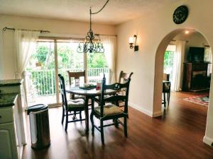 a kitchen and dining room with a table and chairs at Villa Venezia in Fort Lauderdale