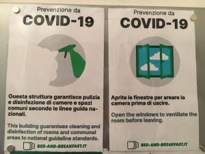 a sign for a building with an umbrella at B&B Casetta del Marinaio in Camogli