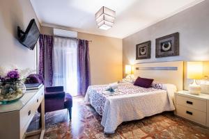 Кровать или кровати в номере Hotel Gines