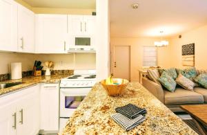 a kitchen and living room with a counter top at Villa Venezia in Fort Lauderdale