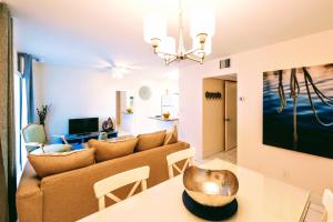a living room with a couch and a table at Villa Venezia in Fort Lauderdale