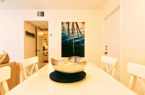 a dining room with a bowl on a table at Villa Venezia in Fort Lauderdale