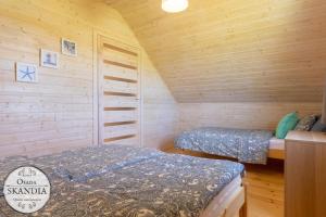 Postel nebo postele na pokoji v ubytování Osada Skandia Kopań