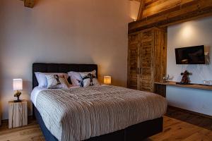 Postel nebo postele na pokoji v ubytování Le Vieux Chalet