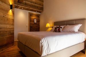 Postel nebo postele na pokoji v ubytování Le Vieux Chalet