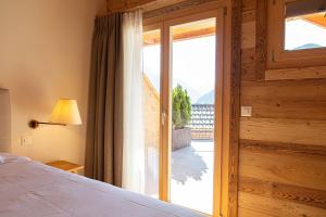 Postel nebo postele na pokoji v ubytování Le Vieux Chalet