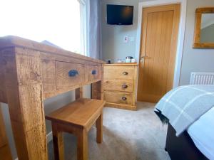 Postel nebo postele na pokoji v ubytování Cairngorm Guest House