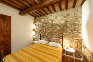Ένα ή περισσότερα κρεβάτια σε δωμάτιο στο Agriturismo Le Radici