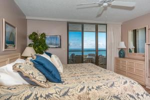 Ένα ή περισσότερα κρεβάτια σε δωμάτιο στο Tradewinds 706 by Ocean Properties +23 φωτογραφίες