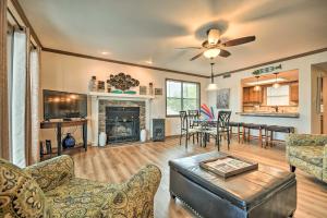 a living room with a couch and a fireplace at Family Resort Condo Near Lake with Boat Slip Access! in Hot Springs