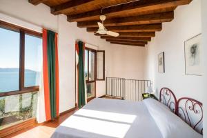 Säng eller sängar i ett rum på Villa Limonaia