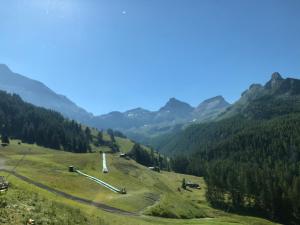 a view of a valley with mountains in the background at Edelweiss Hotel Champoluc in Champoluc