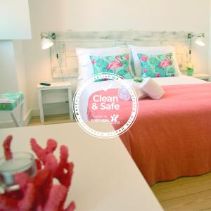 Cama ou camas em um quarto em Living Santa Cruz