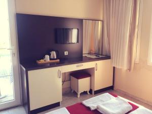 a desk in a room with a window at Dove Apart Hotel in Fethiye