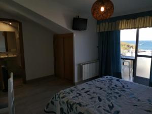 Posteľ alebo postele v izbe v ubytovaní Hotel Estrella del Mar