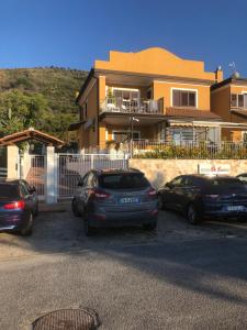a group of cars parked in front of a house at Residenza De Luca b&b in Tropea