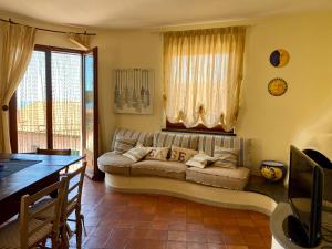 A seating area at Villa Soprana by Agenzia SolturElba