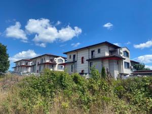 a row of houses on top of a hill at Calisto Villas Arapya in Arapya