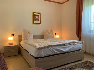 Säng eller sängar i ett rum på Haus Romagnoli Residence