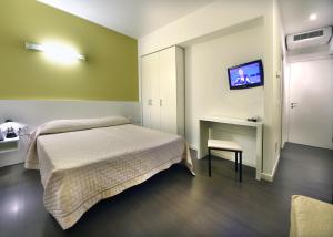 
Postel nebo postele na pokoji v ubytování Hotel Meublè Nazionale
