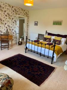 A bed or beds in a room at Low Gingerfield Farm B&B 