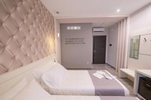A bed or beds in a room at HOLYGOLD Suite ****