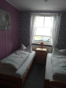 Ένα ή περισσότερα κρεβάτια σε δωμάτιο στο Haus Friede-Rike