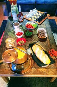 a table with food and a chess board with food at Casa Petrópolis Temporada in Petrópolis +42 photos
