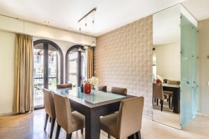 a dining room with a table and chairs at ✦Luxury 2 Bdr David's Village apartment ✦ Mamilla in Jerusalem