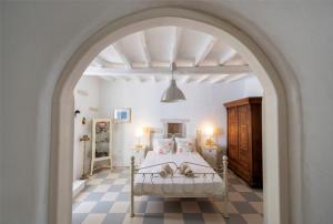 A bed or beds in a room at Traditional stonebuilt house