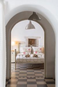 A bed or beds in a room at Traditional stonebuilt house
