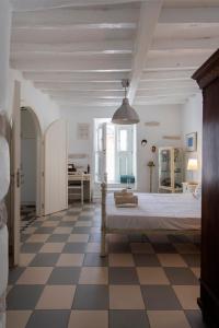 A bed or beds in a room at Traditional stonebuilt house