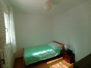 Postel nebo postele na pokoji v ubytování Porat Primošten
