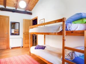 a bedroom with two bunk beds in a room at Holiday Home in Castrotañe near Sil Cañon in Castillón
