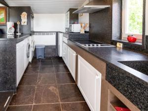 A kitchen or kitchenette at Cozy Chalet with Private Garden near Lake in Westouter