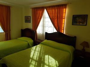 Postel nebo postele na pokoji v ubytování Petite Maison
