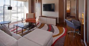 a living room with a couch and a chair at Grand Hyatt San Francisco Union Square in San Francisco