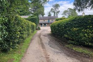 a dirt road in front of a house at Rhubarb Cottage in Enniskillen