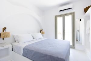 Ένα ή περισσότερα κρεβάτια σε δωμάτιο στο ILI Villa