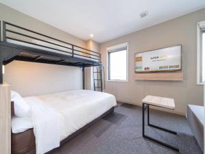 Postel nebo postele na pokoji v ubytování Super Hotel Iyo Saijo