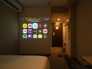 Postel nebo postele na pokoji v ubytování Super Hotel Iyo Saijo