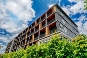 an office building with red and white windows at Umekoji Potel KYOTO in Kyoto +106 photos