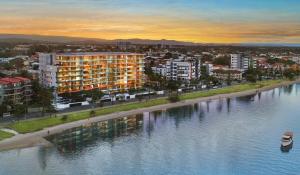 an aerial view of a building next to a river at Silvershore Apartments on the Broadwater in Gold Coast