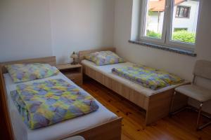Postel nebo postele na pokoji v ubytování Domek letniskowy