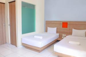 Voodi või voodid majutusasutuse LeGreen Suite Waihaong toas
