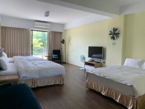 Sunny Sky Homestay客房内的一张或多张床位