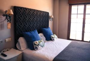 Posteľ alebo postele v izbe v ubytovaní Hotel Rural la Concordia