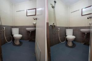 a bathroom with two toilets and a sink at Dago's Hill Hotel in Bandung