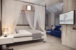 Krevet ili kreveti u jedinici u objektu PORTO PORTES suites